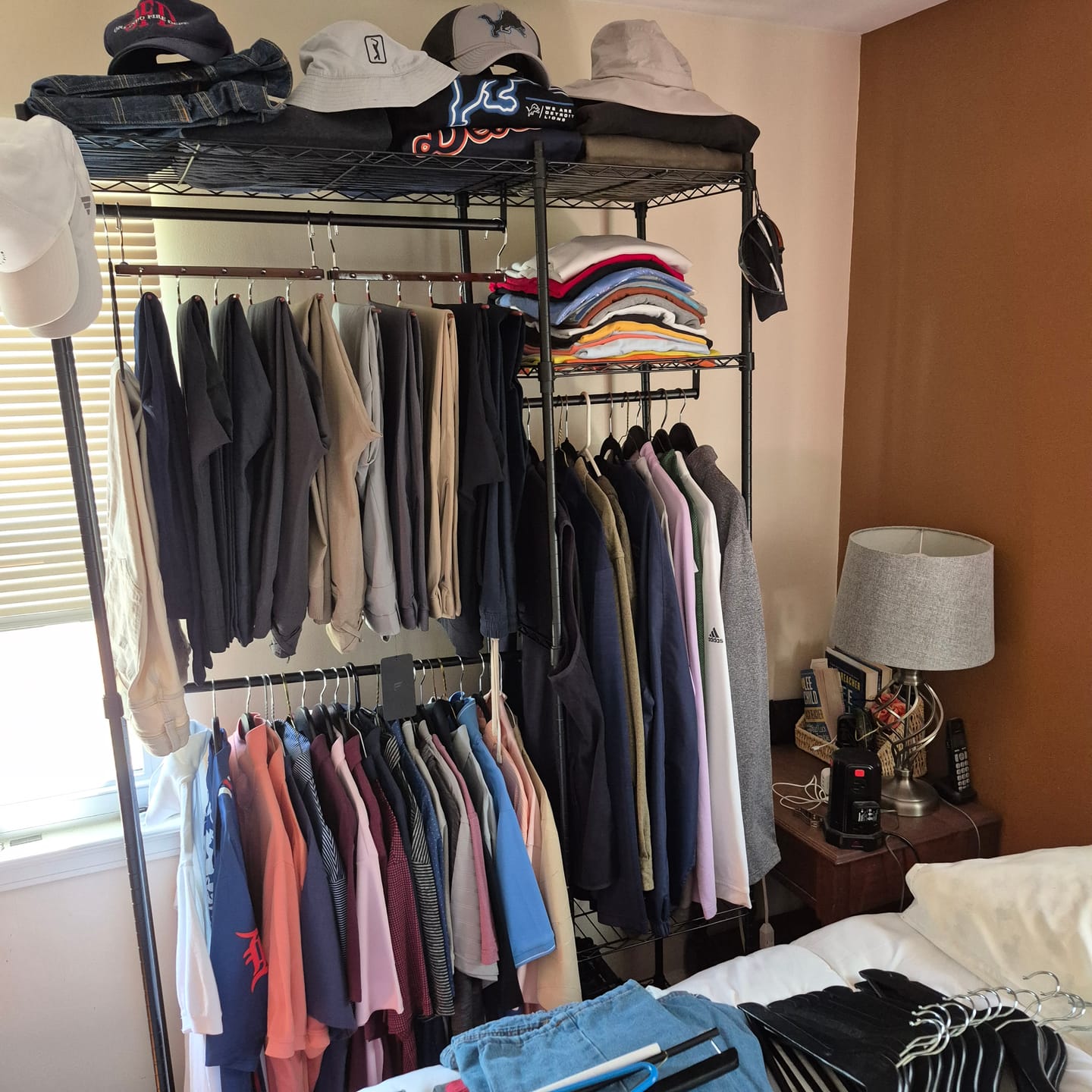 Customer photo review of Raybee Heavy Duty Portable Clothes Rack With Wheels,Clothing Rack For Hanging,Garment Rack For Bedroom