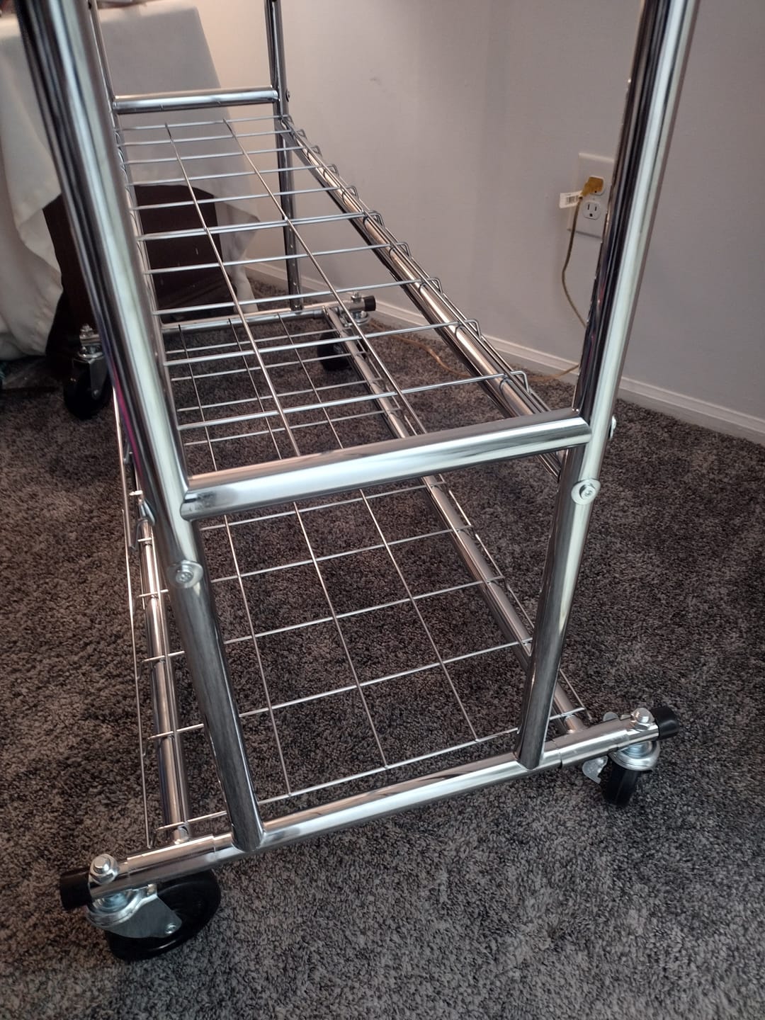 Customer photo review of Raybee 74"W Heavy Duty Clothes Rack on Wheels, 630LBS Adjustable Double Rod Garment Rack, Chrome Metal Commercial Clothing Rack with Storage Shelves
