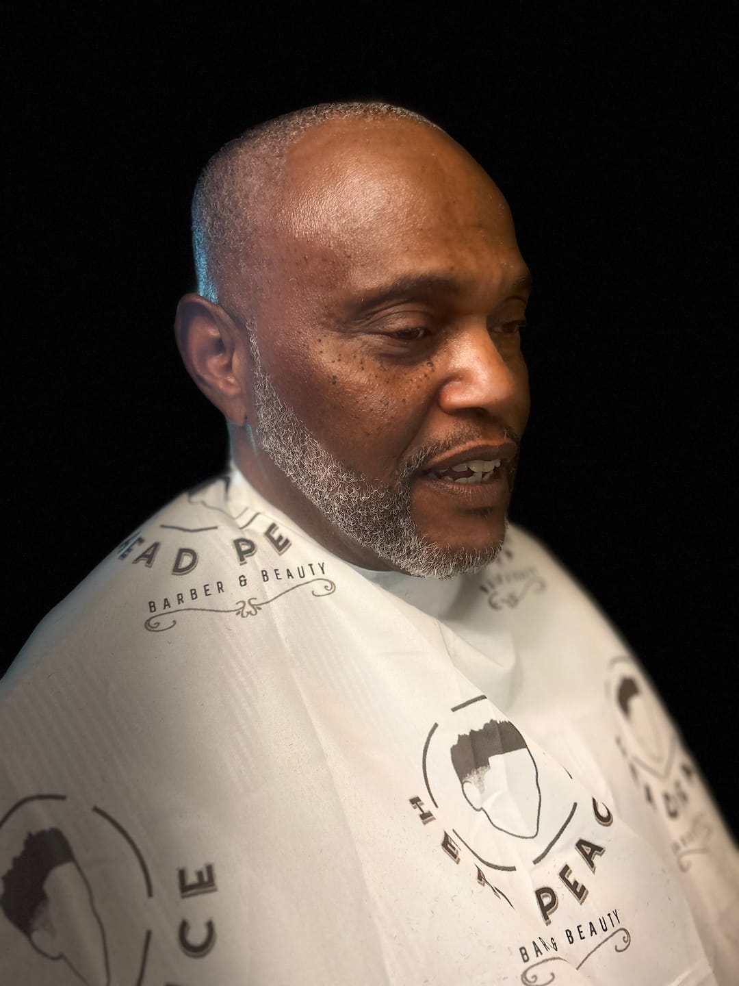 Customer photo review of Custom Barber Cape- Upload Your Logo - Step And Repeat Pattern