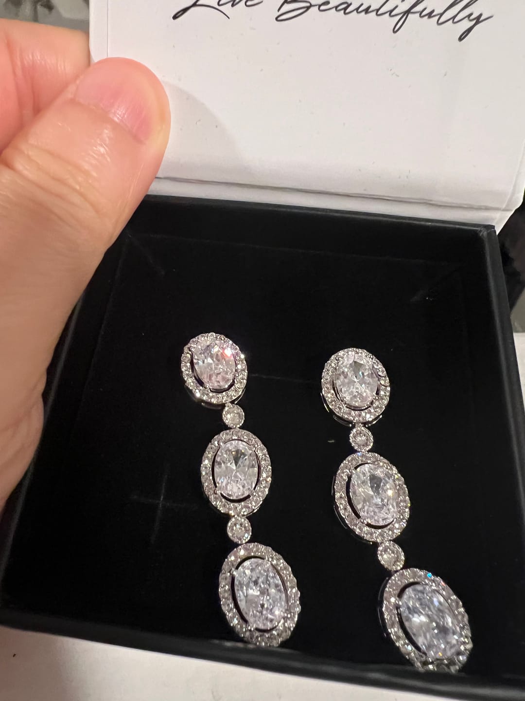 Customer photo review of Lorraine 18k White Gold Plated Dangle Earrings with Simulated Diamond Crystals