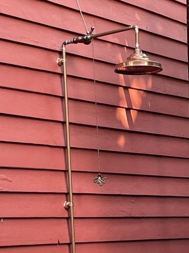Christopher S. verified buyer review photo of Insideast antique copper shower head installed outdoors