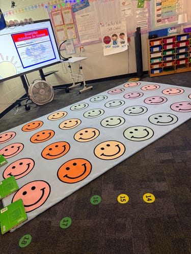 Customer photo review of Pastel Rainbow Smileys Sit Spots Classroom Rug by Schoolgirl Style