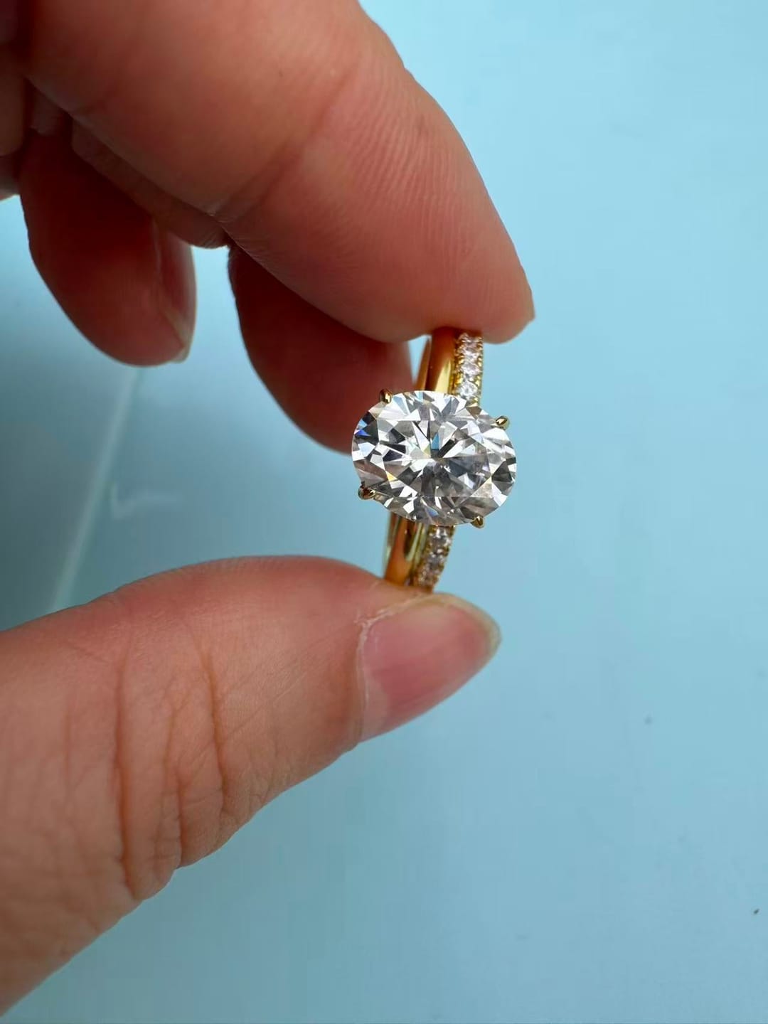 Customer photo review of Moissanite 2.0 Ct Hidden Halo Solitaire Oval Cut Yellow Gold Wedding Ring