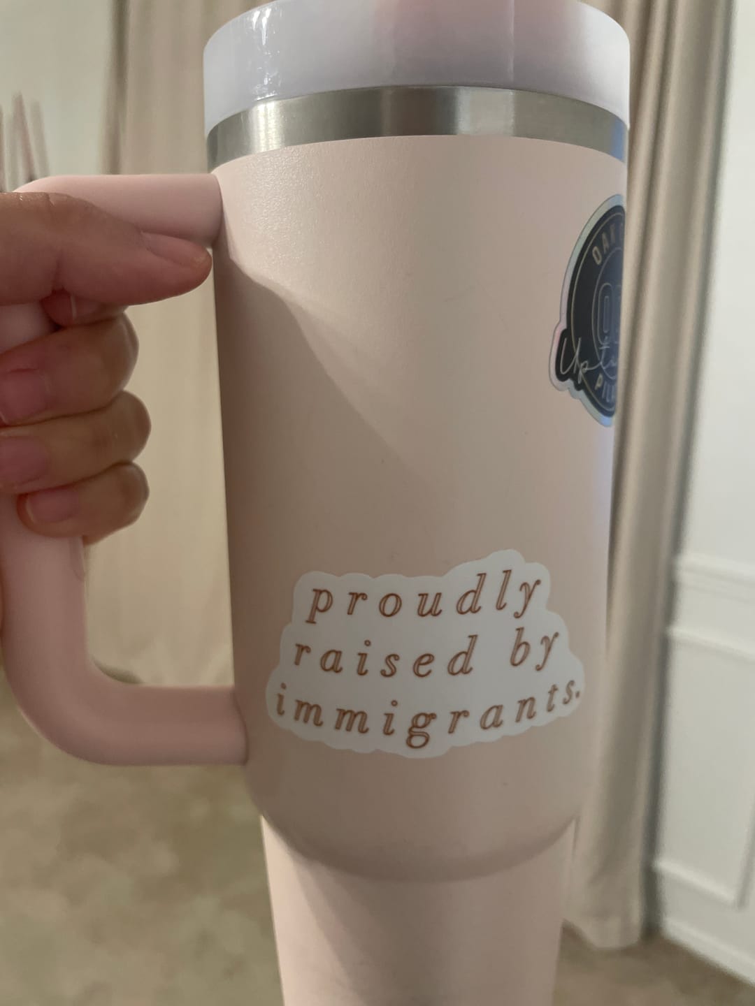 Customer photo review of 'Proudly Raised By Immigrants' Sticker