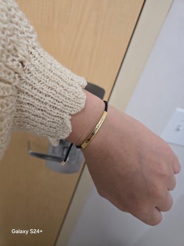 Customer photo review of Remember Who The Fuck You Are Motivational Tube Bracelet