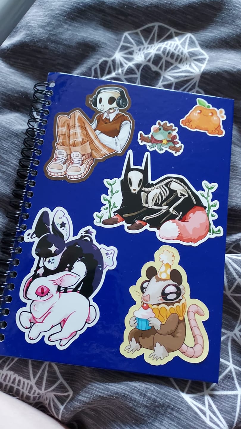 Customer photo review of Sad Party Opossum Stickers!