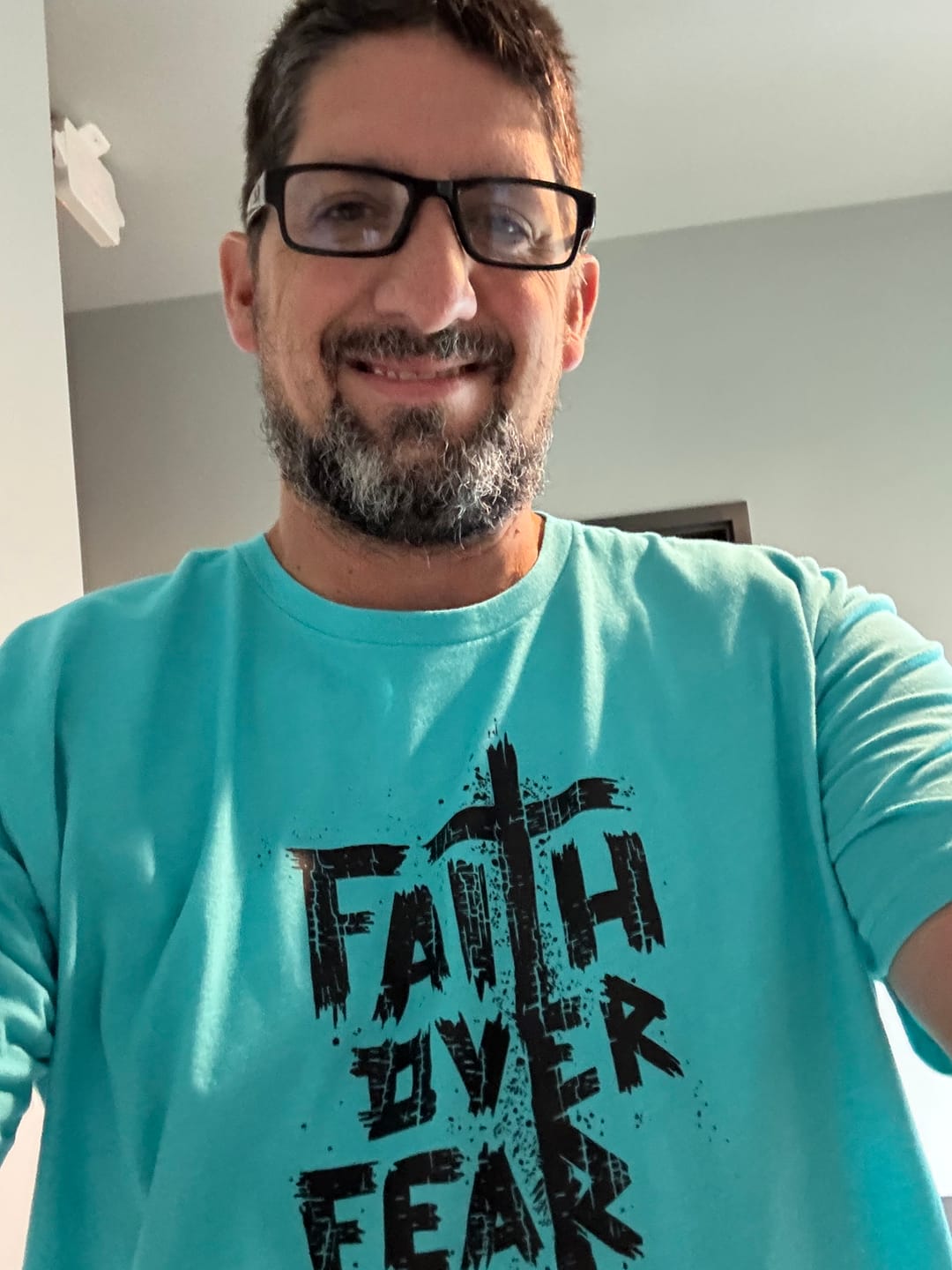 Customer photo review of Faith Over Fear Tee