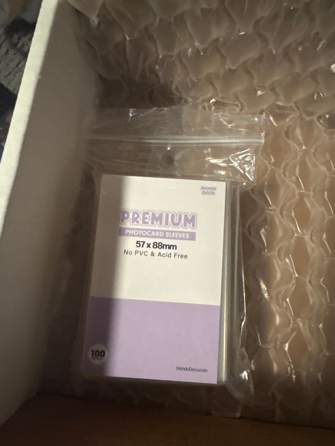 Customer photo review of PREMIUM PHOTOCARD SLEEVES - PURPLE VERSION (57x88MM)