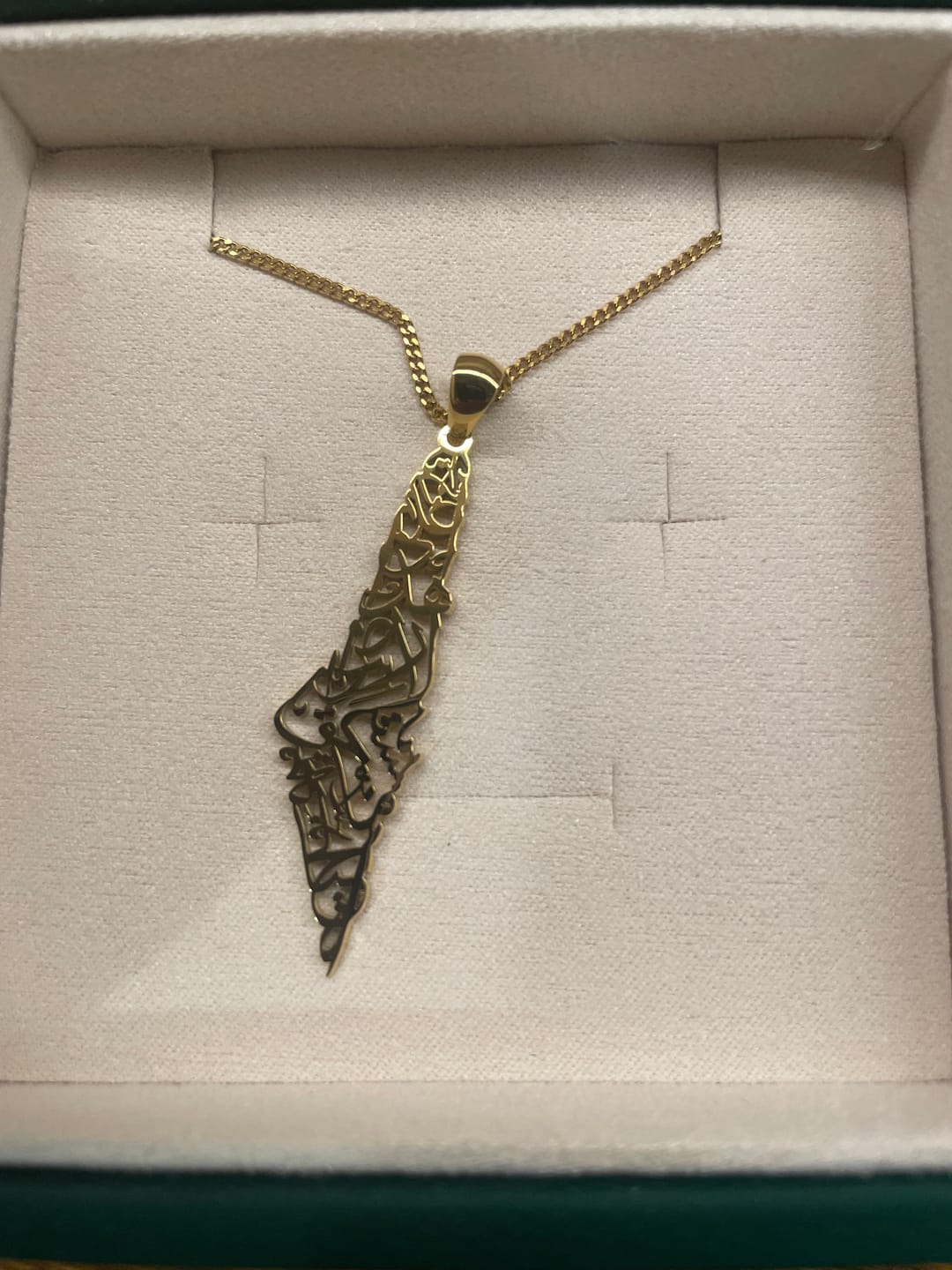Customer photo review of Palestine Calligraphy Map Necklace