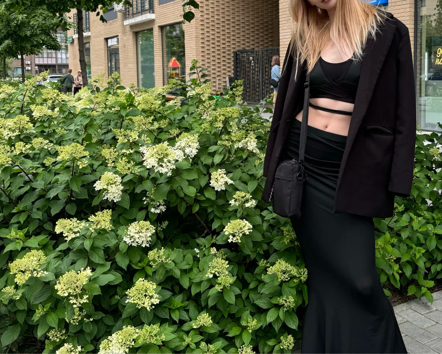 Customer photo review of Lace-Up Bandage Knit Crop Top With V-Neck Cut-Out Long Sleeve And Subtle Sheen — Black | KIMLUD