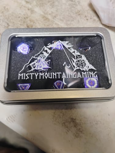 Customer photo review of Cleric's Domain Purple And Silver Metal Dice Set