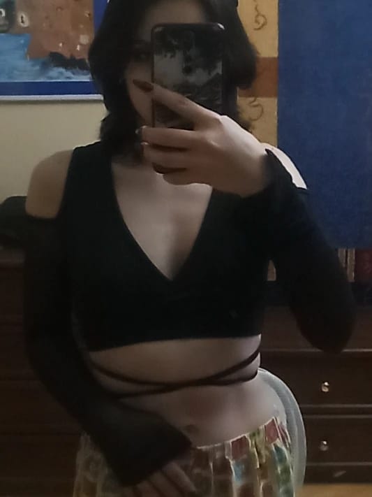 Customer photo review of Lace-Up Bandage Knit Crop Top With V-Neck Cut-Out Long Sleeve And Subtle Sheen — Black | KIMLUD