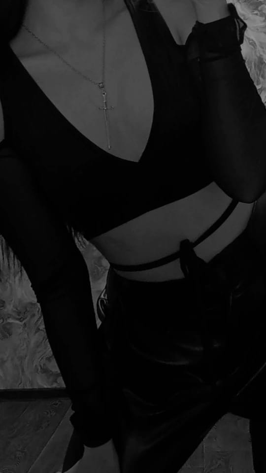 Customer photo review of Lace-Up Bandage Knit Crop Top With V-Neck Cut-Out Long Sleeve And Subtle Sheen — Black | KIMLUD