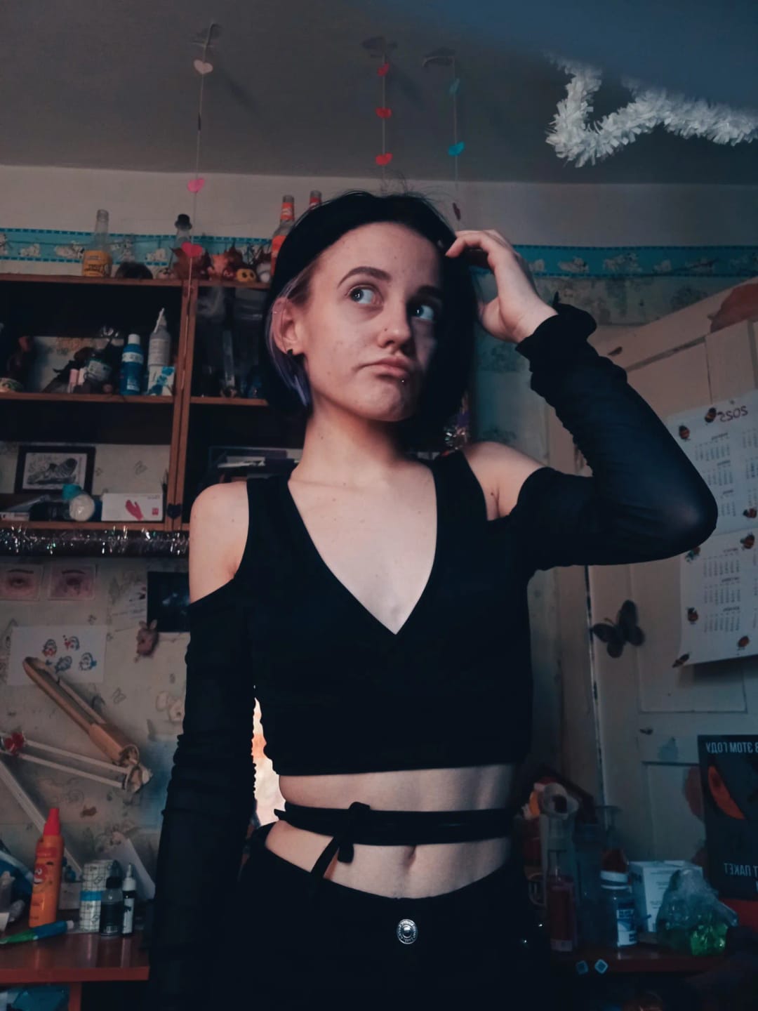 Customer photo review of Lace-Up Bandage Knit Crop Top With V-Neck Cut-Out Long Sleeve And Subtle Sheen — Black | KIMLUD