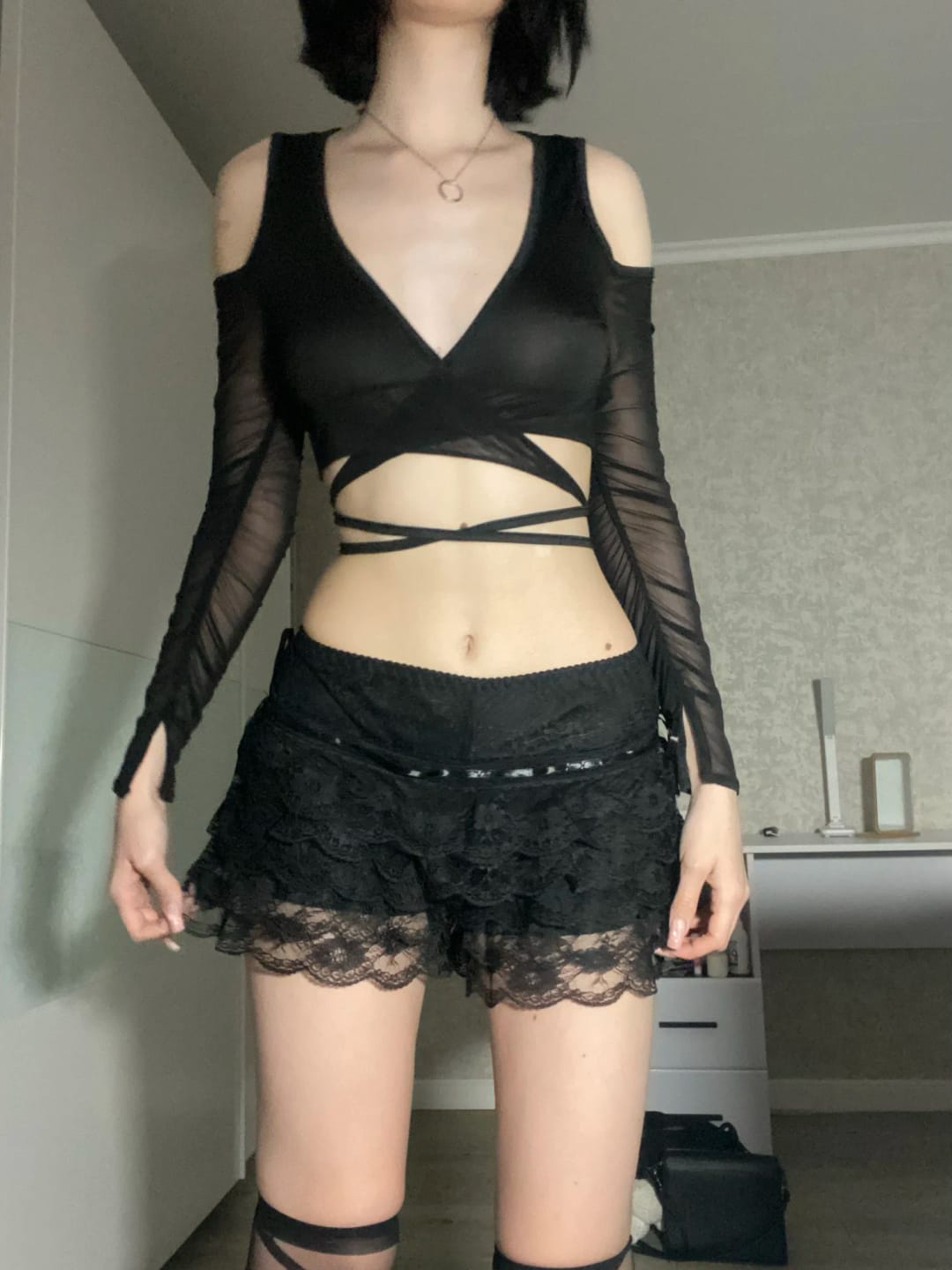 Customer photo review of Lace-Up Bandage Knit Crop Top With V-Neck Cut-Out Long Sleeve And Subtle Sheen — Black | KIMLUD