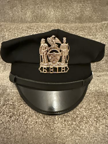 Customer photo review of NY New York Police Officer Badge/Cap Badge Replica Movie Props No. 6818