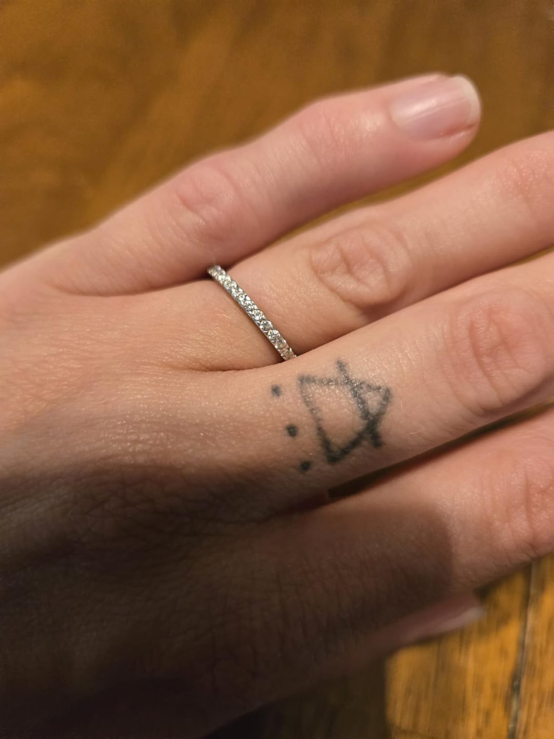 Customer photo review of S925 Half Halo Moissanite 0.5 Ct Round Cut White/Green Stone Anniversary Ring