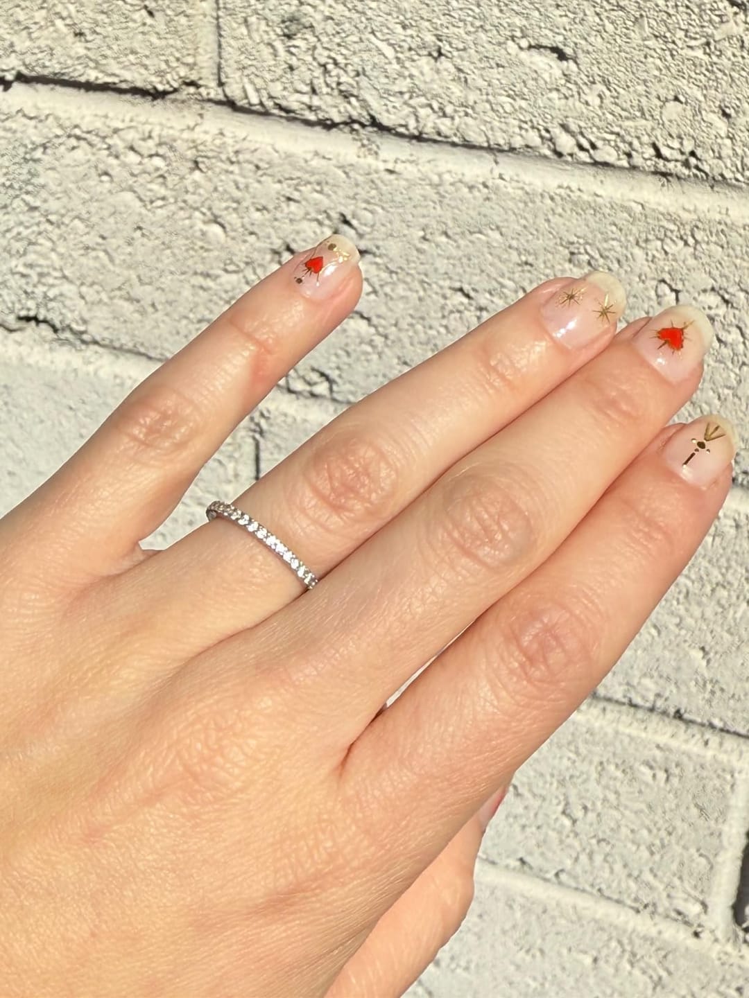 Customer photo review of S925 Half Halo Moissanite 0.5 Ct Round Cut White/Green Stone Anniversary Ring