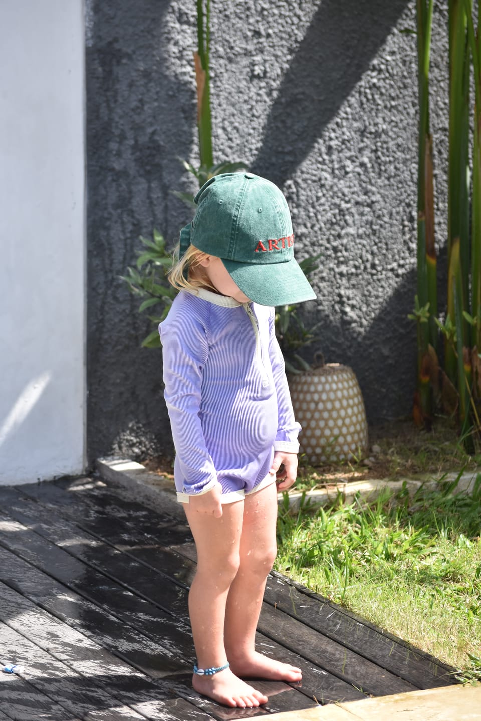 Customer photo review of Zulu & Zephyr - Mini Stripe Rib Rashie Onesie Grape