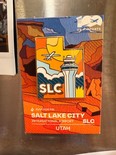 Customer photo review of Airport Enamel Pin | SLC - Utah