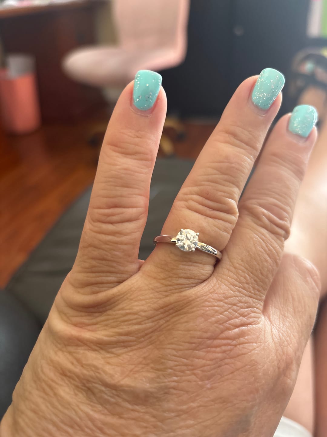 Customer photo review of Classic Solitaire Round Moissanite Four Prong Engagement Ring