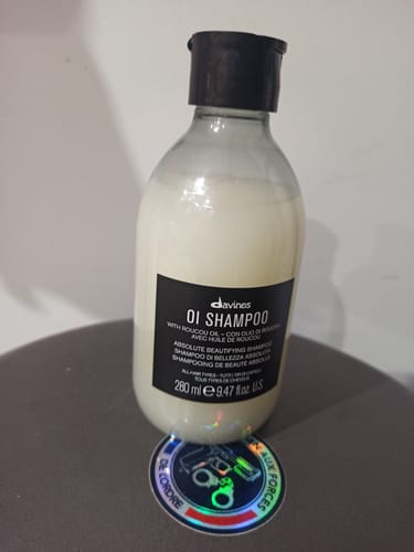 Avis photo d'un client sur OI Shampoo