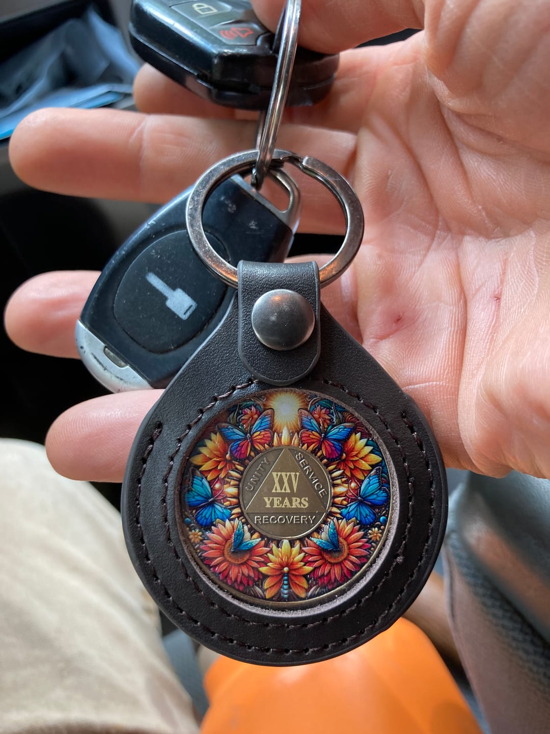 Customer photo review of Sobriety Mint Genuine Leather 34mm AA Medallion Keychain Holder - Recovery Chip/Coin/Token Holder - Dark Brown