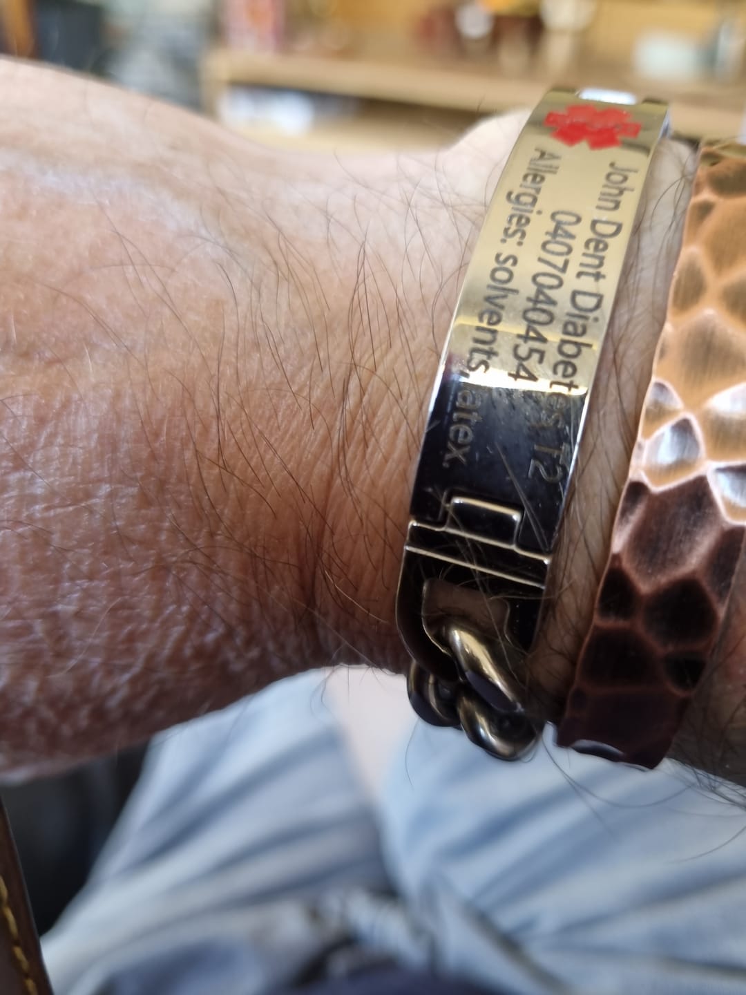 Customer photo review of UniSafe Medical ID Bracelet – Silver with Red Emblem