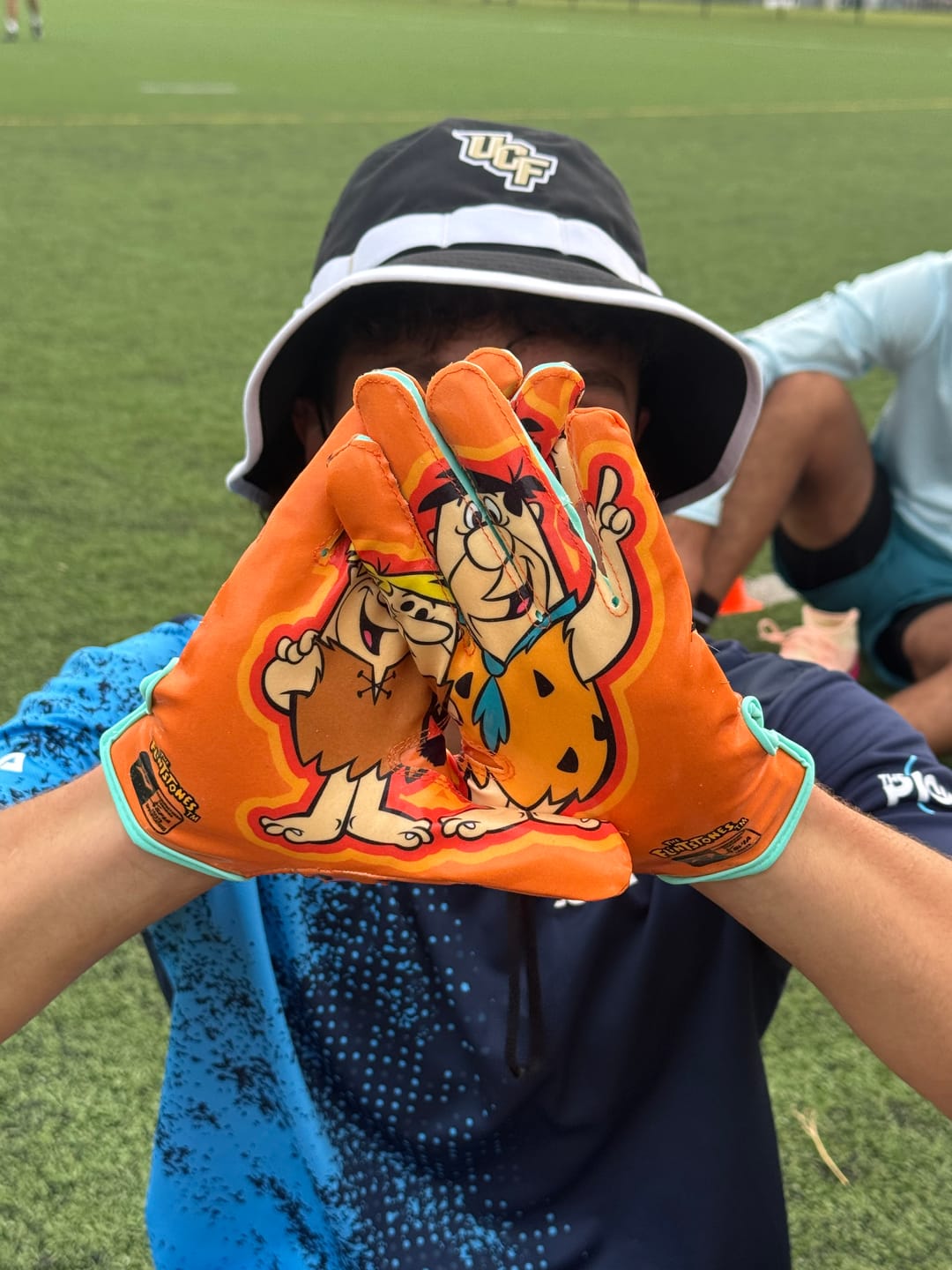 Customer photo review of The Flintstones "Bedrock Blitz" Football Gloves - VPS5 by Phenom Elite
