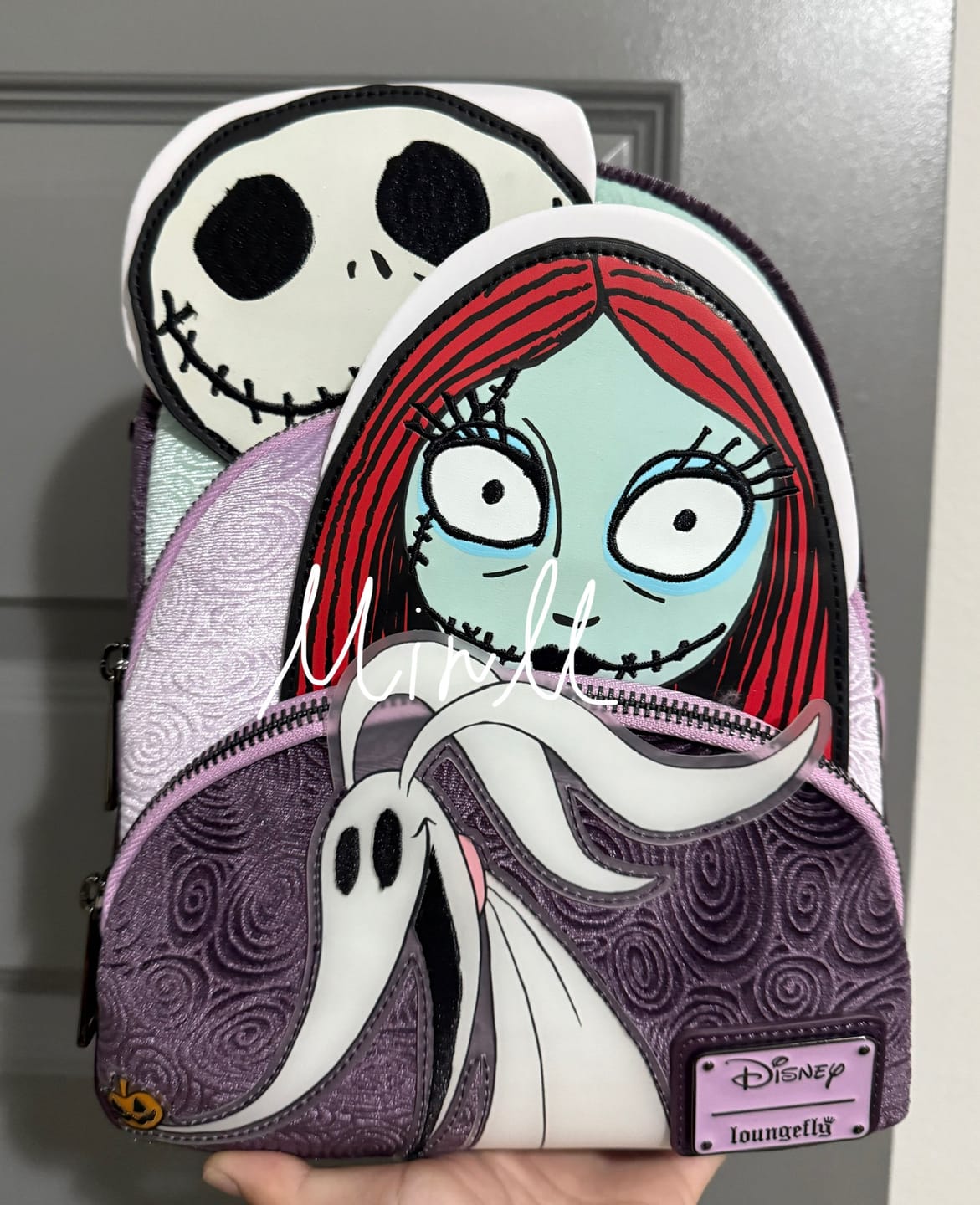 Customer photo review of Loungefly Disney Nightmare Before Christmas Glow in the Dark Jack, Sally and Zero Mini Backpack - 707 Street Exclusive