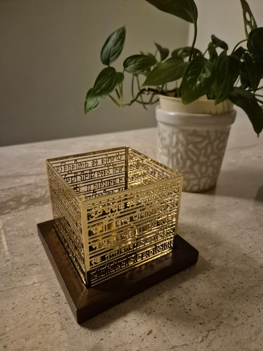 Customer photo review of Gayatri Mantra Tea Light Holder - Teak & Brass