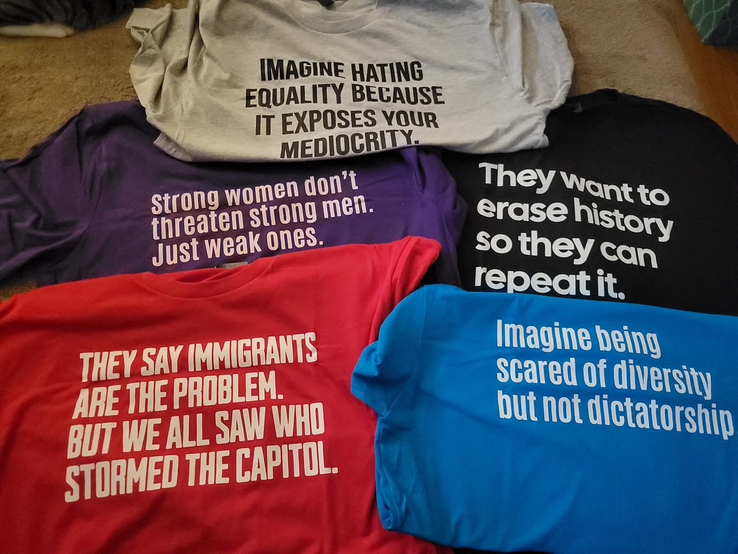 Customer photo review of Strong Women Don’t Threaten Strong Men. Just Weak Ones Unisex Tee (Limited Edition)