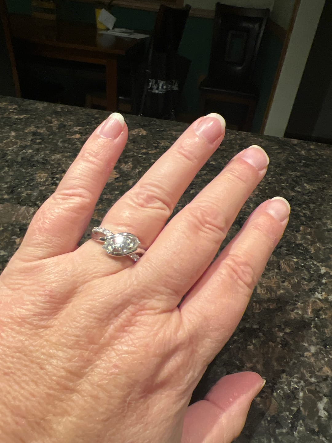 Customer photo review of Swirl Three Stone Moissanite Twisted Pave Engagement Ring