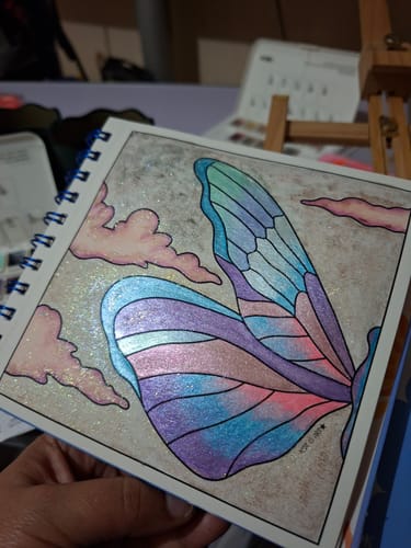 Customer photo review of BOX 1: ENCANTO ESENCIAL (incluye saco coloreable + postales)