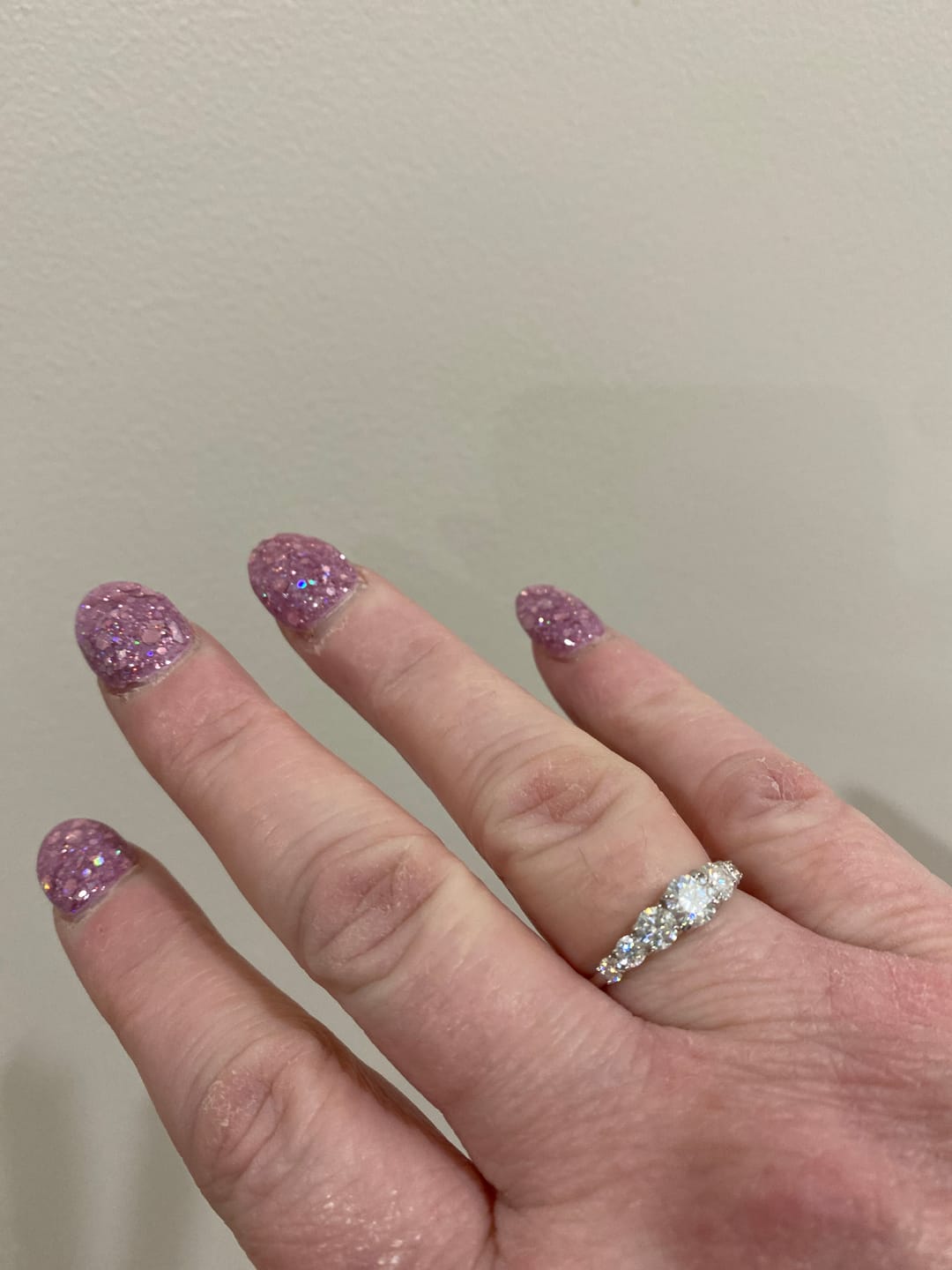 Customer photo review of Aura Love Eternity Band with 7 Sparkling Moissanite Gems - Platinum Plated