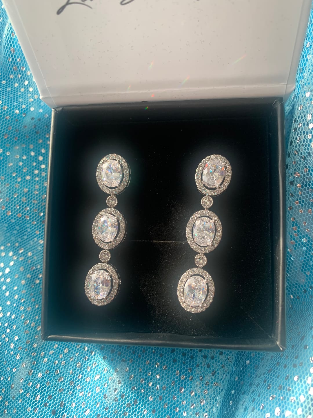 Customer photo review of Lorraine 18k White Gold Plated Dangle Earrings with Simulated Diamond Crystals