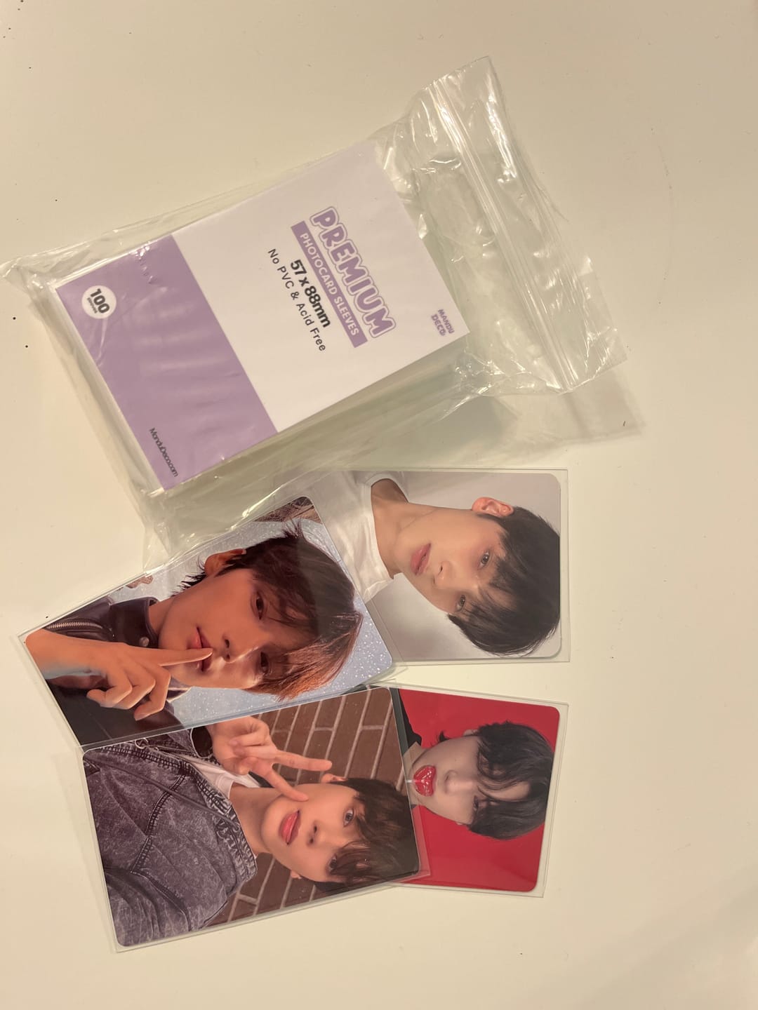 Customer photo review of PREMIUM PHOTOCARD SLEEVES - PURPLE VERSION (57x88MM)