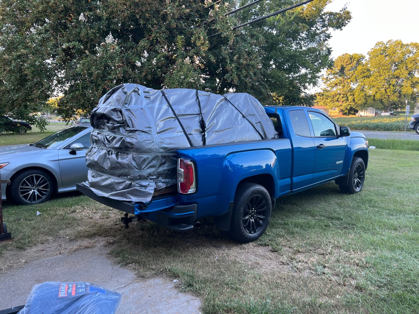 Customer photo review of TorkStrap M500 | 14'x1'' Spring Loaded Tie Down Straps - Adapts to Load Shifts - 1500lbs Max Load - Just Pull Alternative to Ratchet Straps with Hooks - For Securing Motorcycles, Kayaks, ATVs