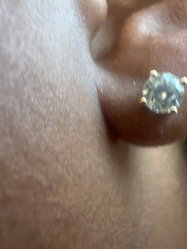 Customer photo review of VVS Moissanite Solitaire Stud Earrings