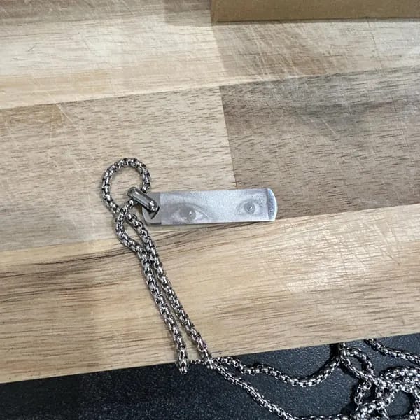 Customer photo review of Custom Engraved Eyes Necklace