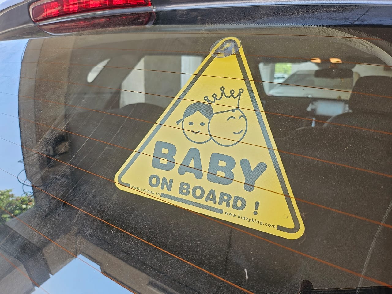 Customer photo review of Baby On Board Sign with two suction cup | Back side Window Hanging Safety Sign for Rush Drivers