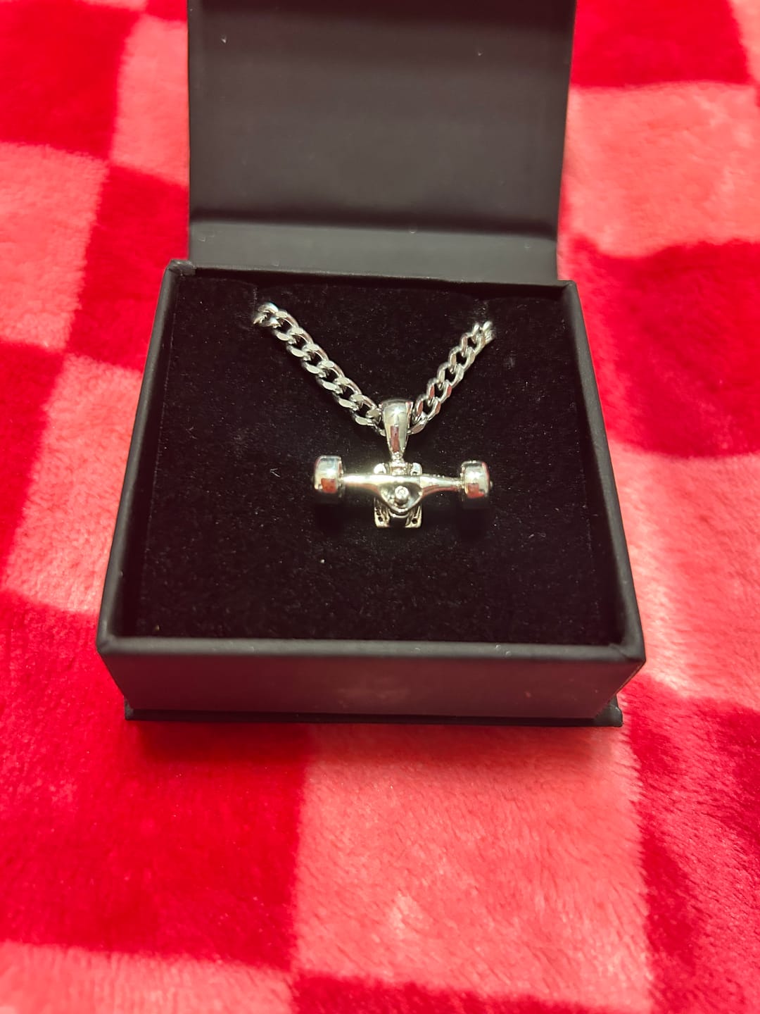 Customer photo review of Skateboard Truck w/Wheels Pendant (Silver)
