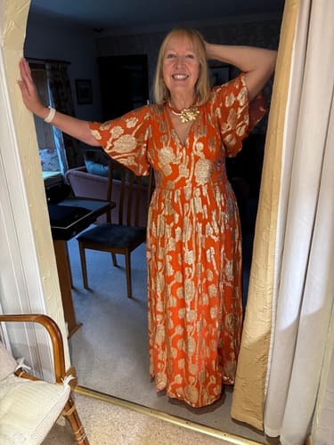 Customer photo review of Orange Metallic Jacquard Flutter Sleeves Floral Maxi Dress