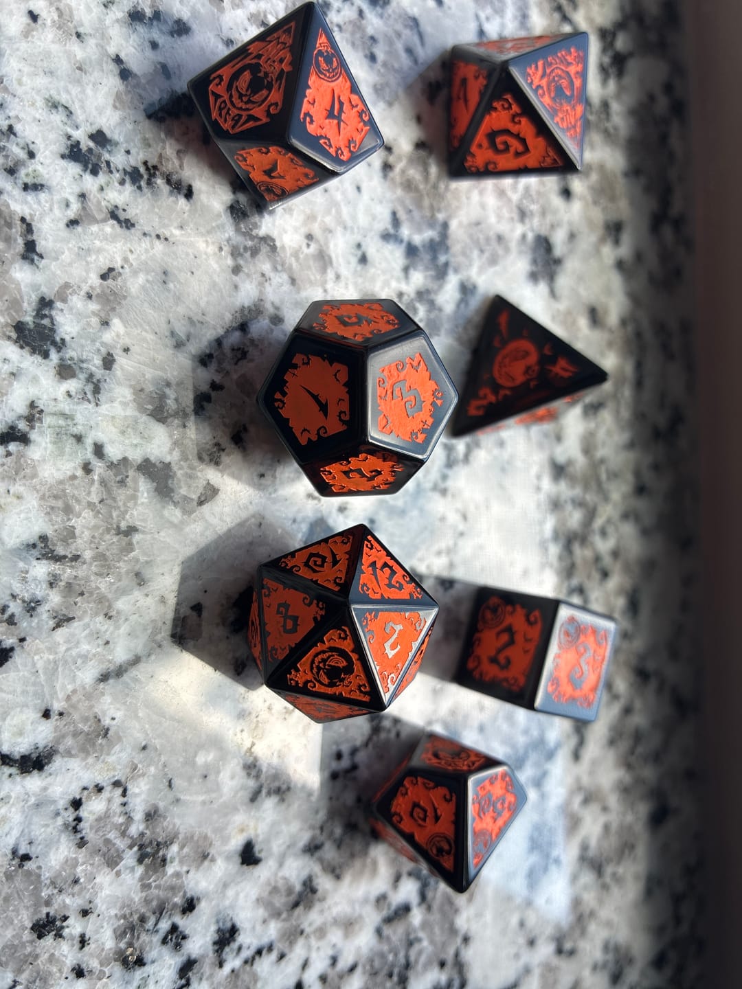 Customer photo review of URWizards D&D Obsidian Engraved Dice Set Halloween Pumpkin Style
