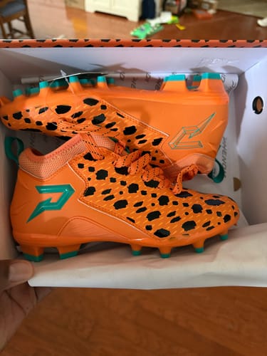 Customer photo review of The Flintstones "Bedrock Blitz" Football Cleats - Quantum Speed by Phenom Elite