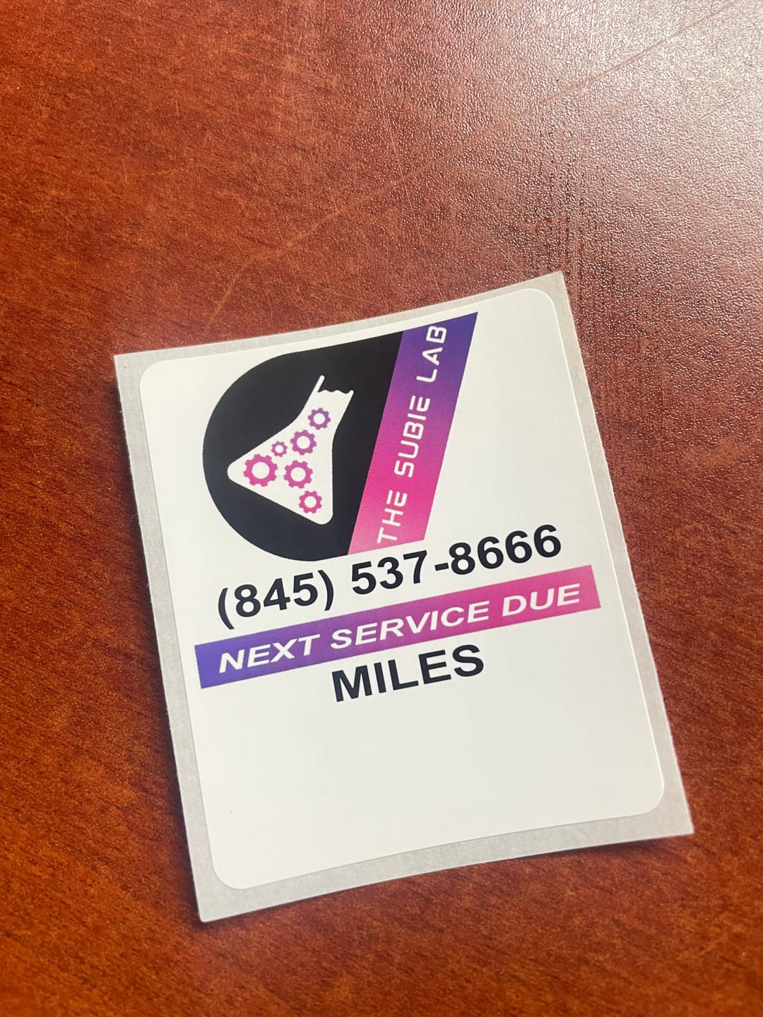 Customer photo review of Custom Oil Change Stickers for Windshield with Logo