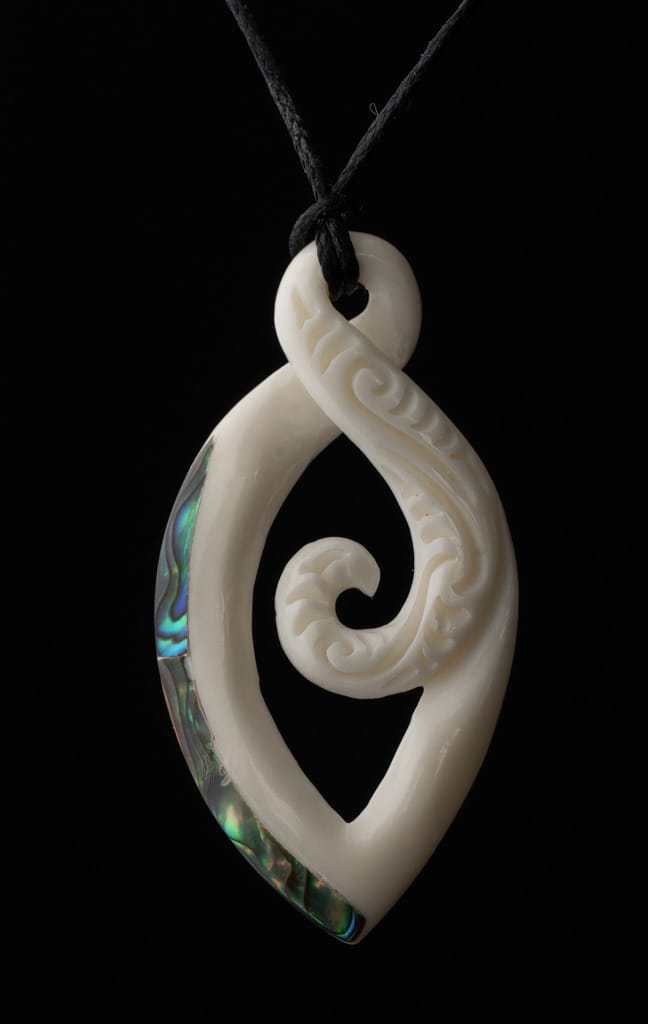 Customer photo review of Maori Bone Twist Pendant with Inner Koru and Paua Trim
