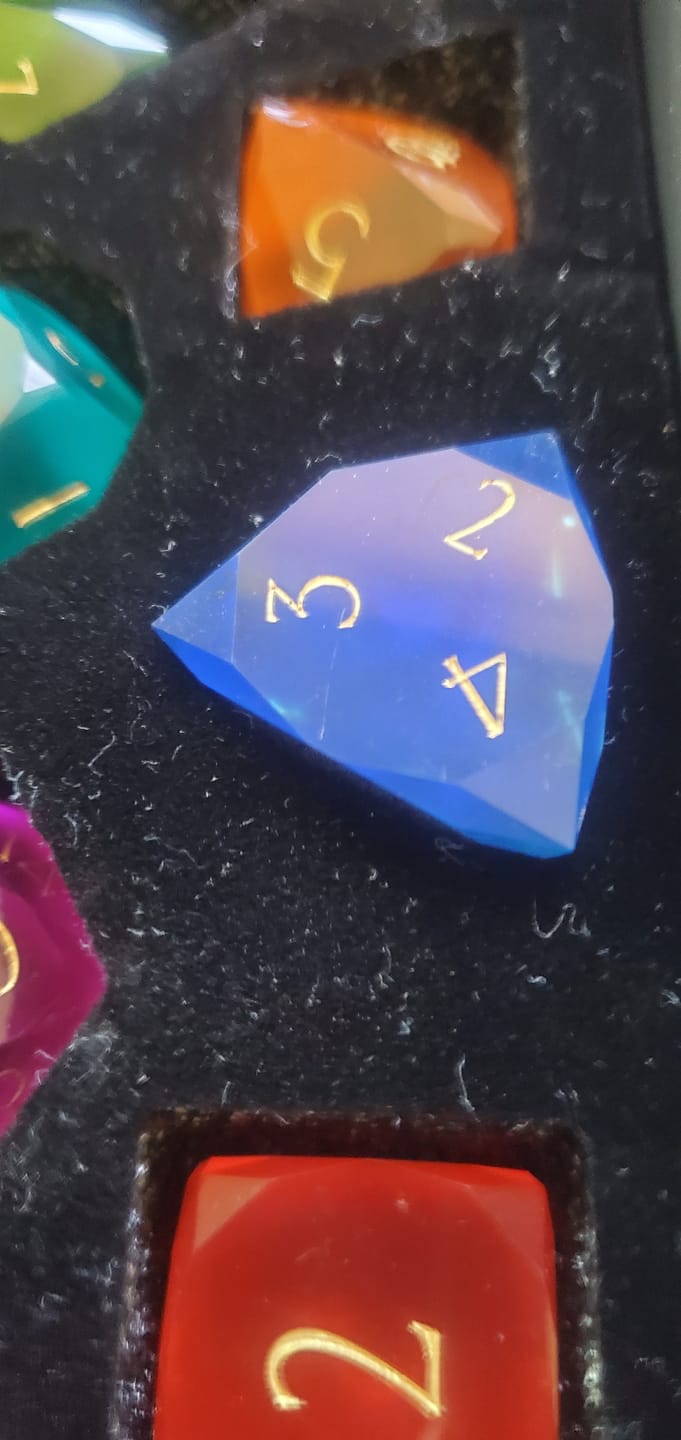 Customer photo review of URWizards D&D Resin Rainbow Candy Engraved Dice Set Multi-faceted Style
