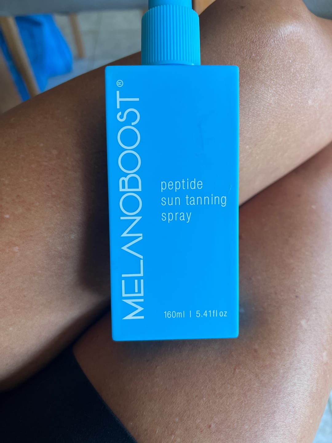 Customer photo review of Melanoboost Peptide Sun Tanning Spray
