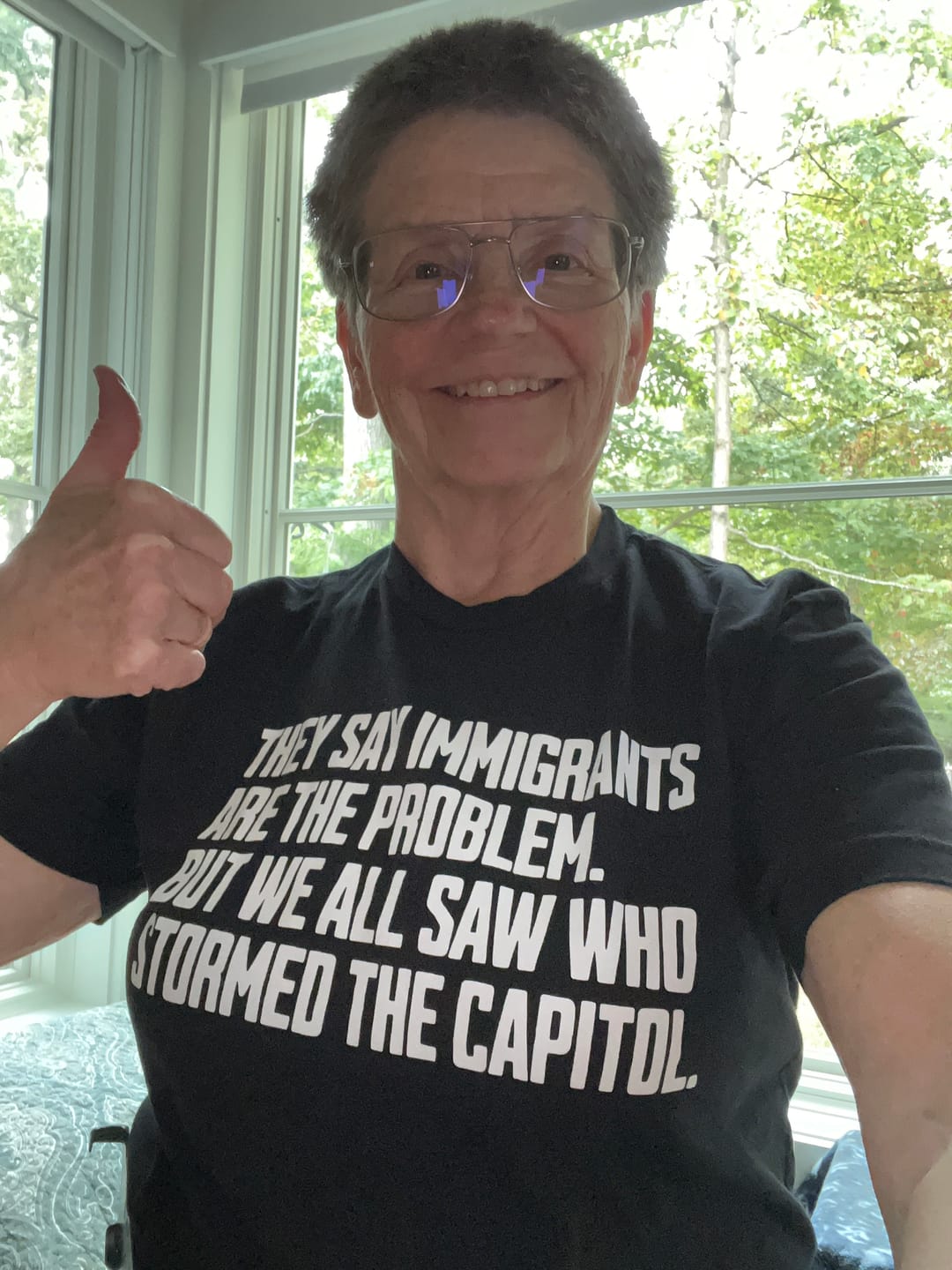 Customer photo review of They Say Immigrants Are the Problem. But We All Saw Who Stormed the Capitol Unisex Tee